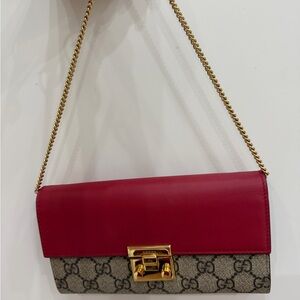 Gucci wallet on chain with red leather and beige GG Canvas. Gold chain strap
